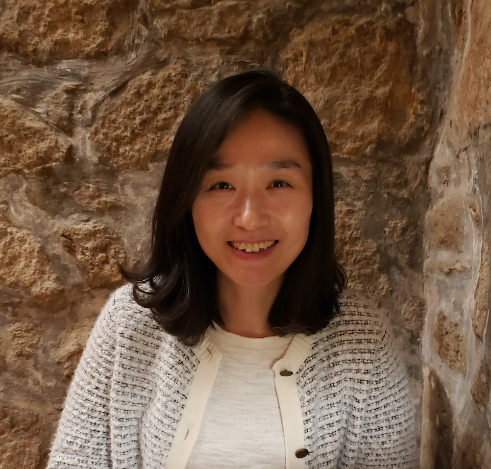 Greg Siering poses for a headshot. He wears a blazer and tie.